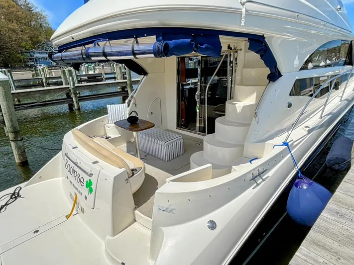 Saoirse Yacht Photos Pics 2011 Meridian 441 Sedan yacht docked, featuring outdoor seating and elegant design.