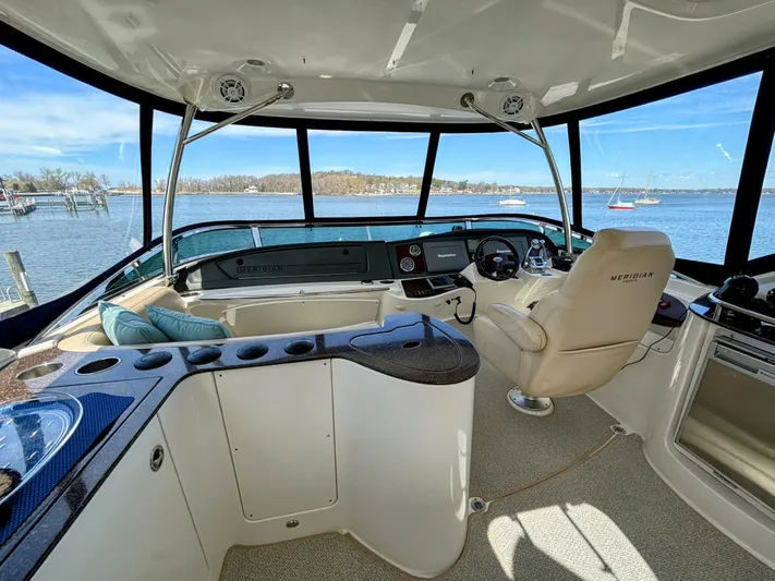 Saoirse Yacht Photos Pics Interior of 2011 Meridian 441 Sedan yacht with helm, seating, and panoramic windows.