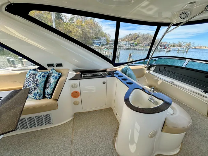 Saoirse Yacht Photos Pics Luxurious interior of 2011 Meridian 441 Sedan yacht with seating and scenic marina view.