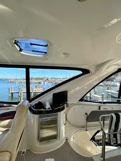 Saoirse Yacht Photos Pics Interior view of 2011 Meridian 441 Sedan yacht with marina backdrop.