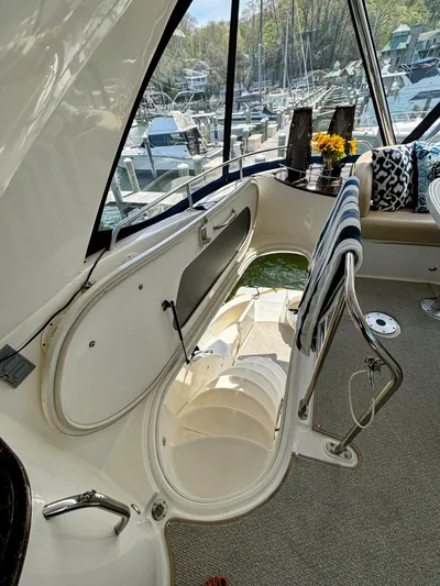 Saoirse Yacht Photos Pics Interior of a 2011 Meridian 441 Sedan yacht with open hatch and marina view.