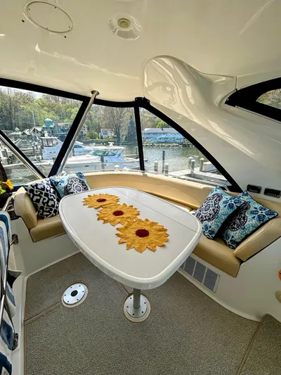 Saoirse Yacht Photos Pics Interior of 2011 Meridian 441 Sedan yacht with stylish seating and decorative table.