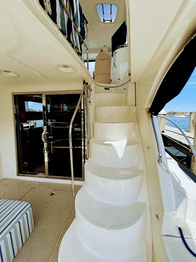 Saoirse Yacht Photos Pics 2011 Meridian 441 Sedan yacht interior with staircase and seating area.