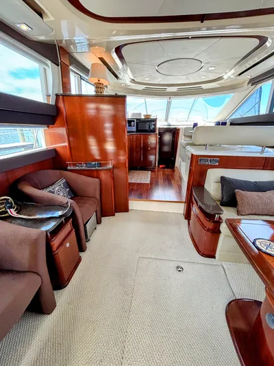 Saoirse Yacht Photos Pics Luxurious interior of a 2011 Meridian 441 Sedan yacht with elegant wood finishes.