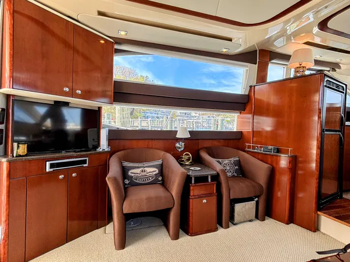 Saoirse Yacht Photos Pics Luxurious interior of a 2011 Meridian 441 Sedan yacht with elegant wood finishes.