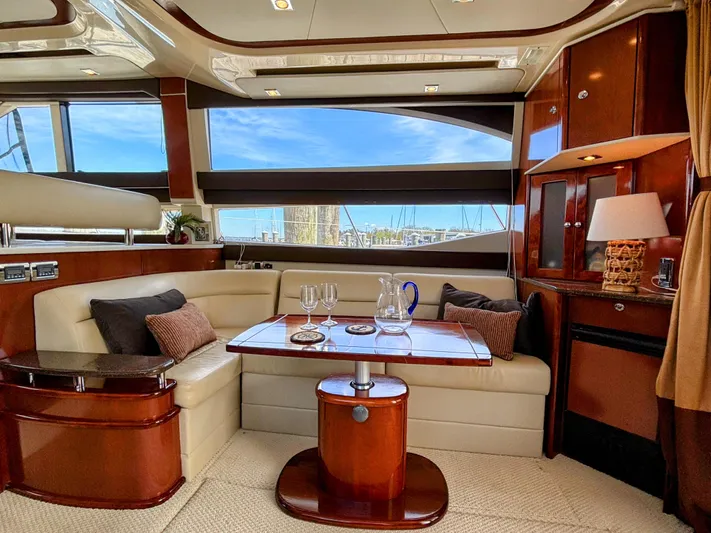 Saoirse Yacht Photos Pics Luxurious interior of 2011 Meridian 441 Sedan yacht with elegant seating and table.