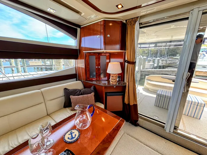 Saoirse Yacht Photos Pics Interior of 2011 Meridian 441 Sedan yacht with elegant seating and marina view.