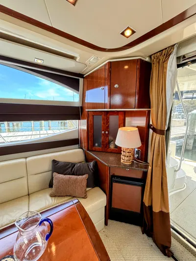 Saoirse Yacht Photos Pics Luxurious interior of 2011 Meridian 441 Sedan yacht with elegant furnishings and scenic window view.