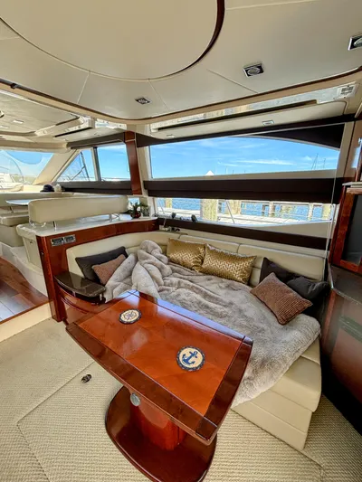 Saoirse Yacht Photos Pics Luxurious interior of 2011 Meridian 441 Sedan yacht with cozy seating and scenic view.