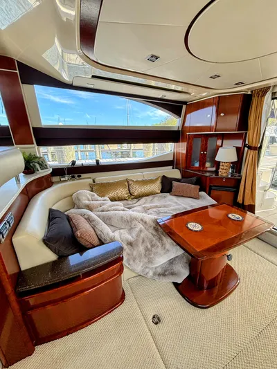 Saoirse Yacht Photos Pics Luxurious interior of a 2011 Meridian 441 Sedan yacht with plush seating and elegant decor.