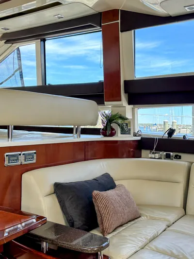 Saoirse Yacht Photos Pics Luxurious interior of a 2011 Meridian 441 Sedan yacht with plush seating and elegant decor.