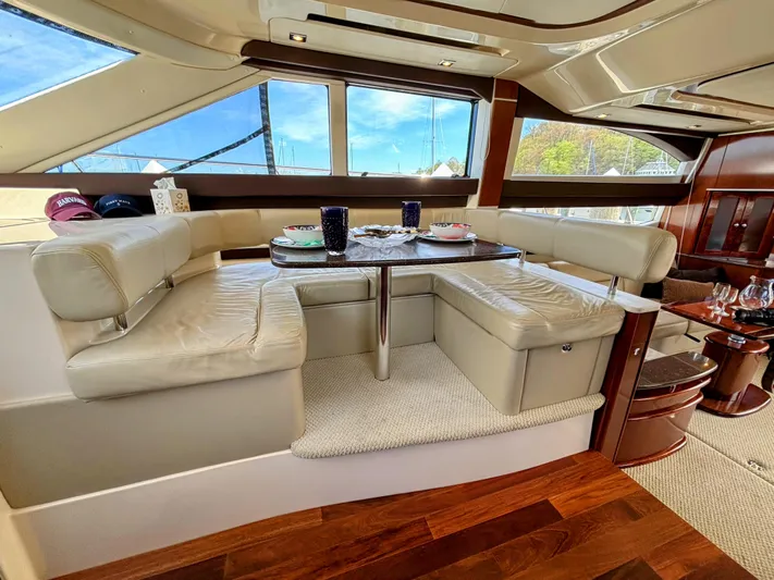 Saoirse Yacht Photos Pics Luxurious interior of 2011 Meridian 441 Sedan yacht with elegant dining area.