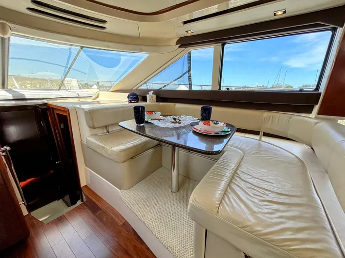 Saoirse Yacht Photos Pics Luxurious interior of 2011 Meridian 441 Sedan yacht with elegant seating and dining area.
