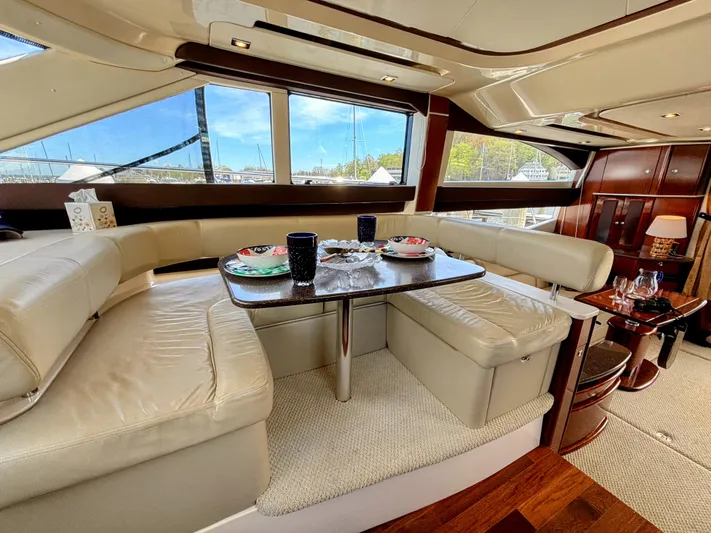 Saoirse Yacht Photos Pics Luxurious interior of 2011 Meridian 441 Sedan yacht with elegant dining area.