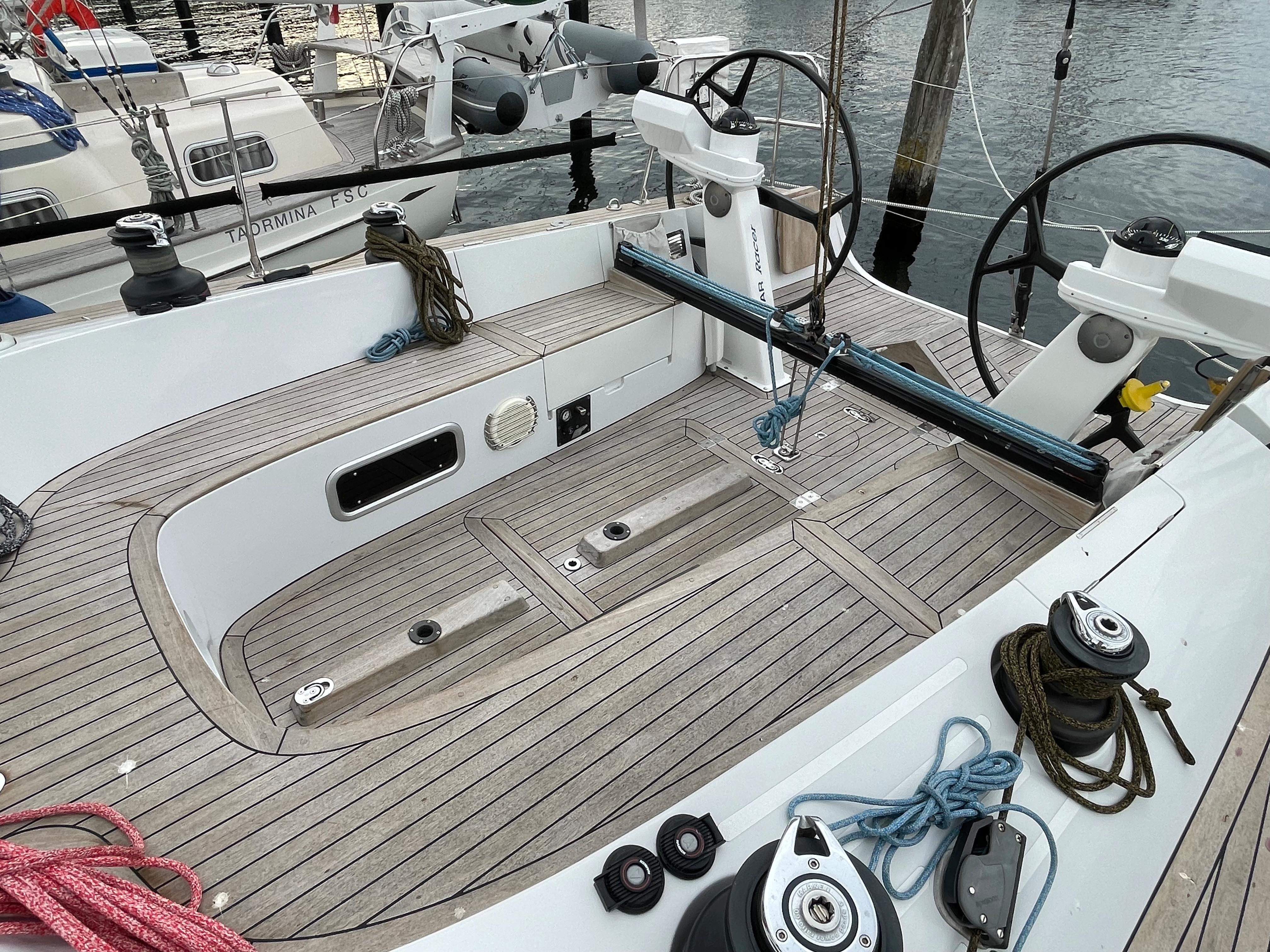 2005 Comet 45 S sailboat cockpit with dual steering wheels and teak decking.