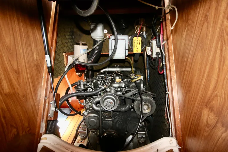 Exfil Yacht Photos Pics Engine compartment of a 1998 Beneteau Oceanis 461 sailboat, showcasing mechanical components.
