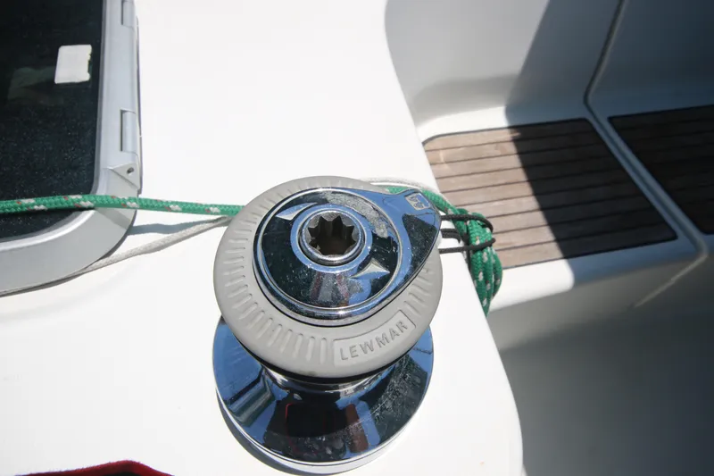 Exfil Yacht Photos Pics Winch on 1998 Beneteau Oceanis 461 sailboat deck with green rope.