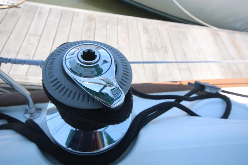 Exfil Yacht Photos Pics Winch on 1998 Beneteau Oceanis 461 sailboat, docked by wooden pier.