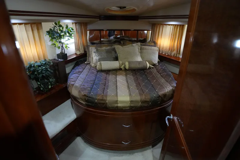 So Far Yacht Photos Pics Luxurious bedroom interior of 2004 Carver 560 Voyager yacht with elegant bedding and decor.
