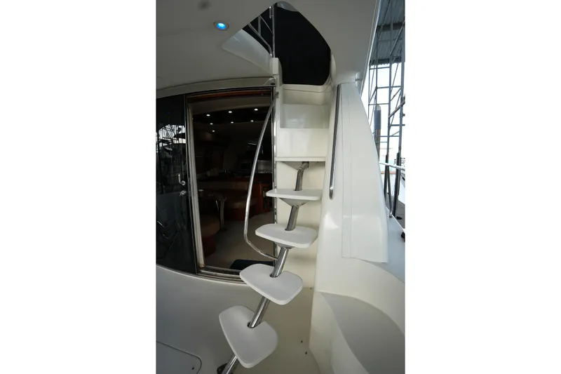 So Far Yacht Photos Pics Staircase inside 2004 Carver 560 Voyager yacht, leading to upper deck.