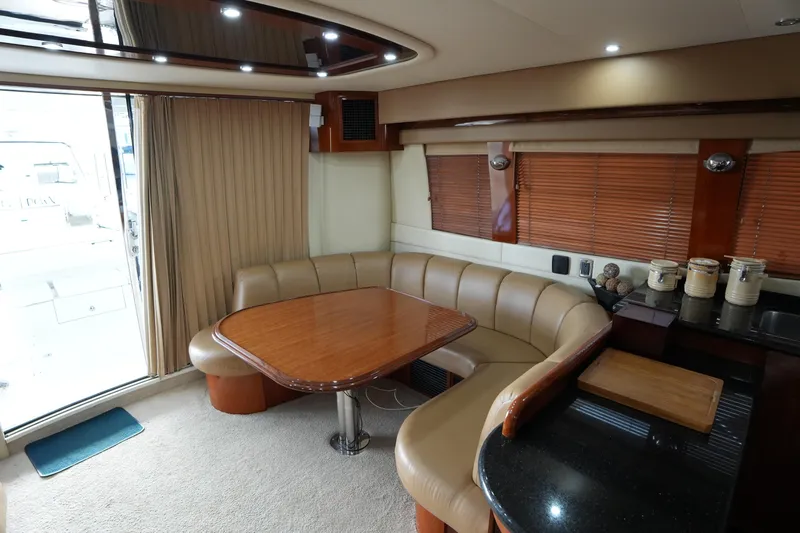 So Far Yacht Photos Pics Luxurious interior of 2004 Carver 560 Voyager yacht with elegant dining area.