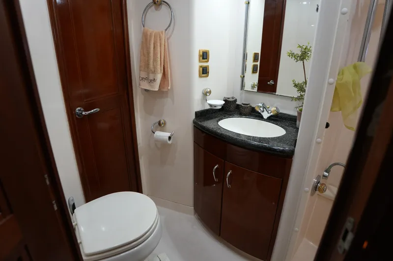 So Far Yacht Photos Pics Luxurious bathroom in 2004 Carver 560 Voyager yacht with elegant wood cabinetry.