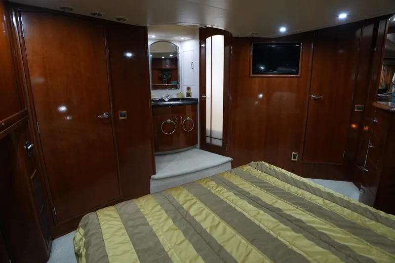 So Far Yacht Photos Pics Luxurious interior of 2004 Carver 560 Voyager yacht with wood paneling and modern amenities.