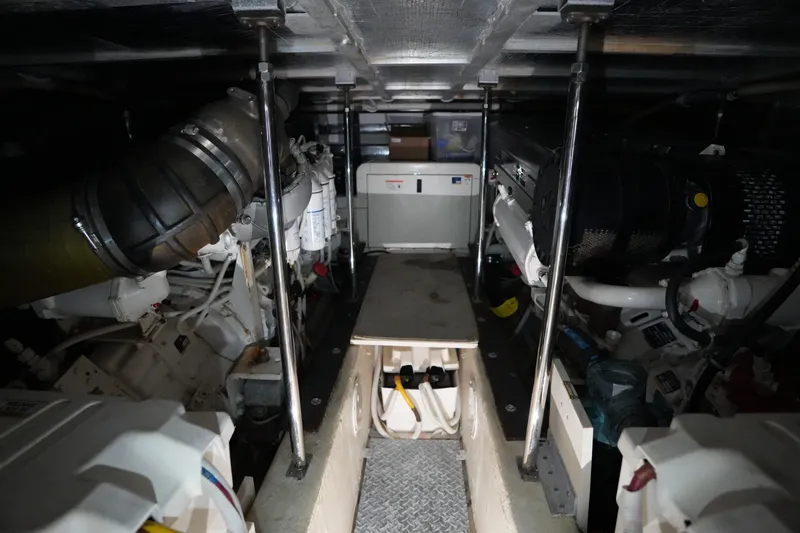 So Far Yacht Photos Pics Engine room of a 2004 Carver 560 Voyager yacht, showcasing mechanical components.