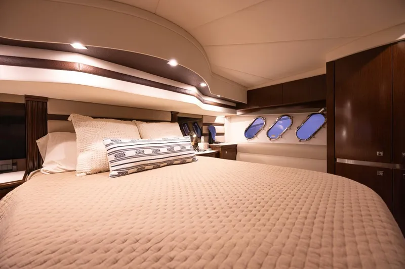 Epic Yacht Photos Pics Luxurious bedroom interior of 2013 Cruisers Yachts 540 Sports Coupe with elegant bedding.