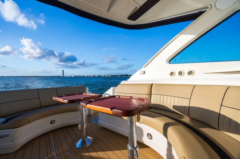 Epic Yacht Photos Pics Luxurious 2013 Cruisers Yachts 540 Sports Coupe interior with ocean view and elegant seating.