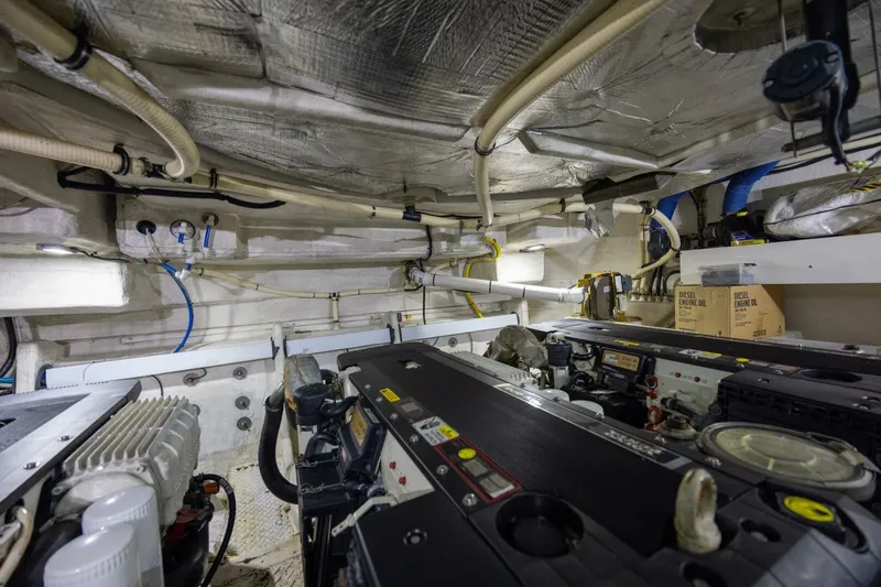 Epic Yacht Photos Pics Engine room of 2013 Cruisers Yachts 540 Sports Coupe with visible machinery and piping.