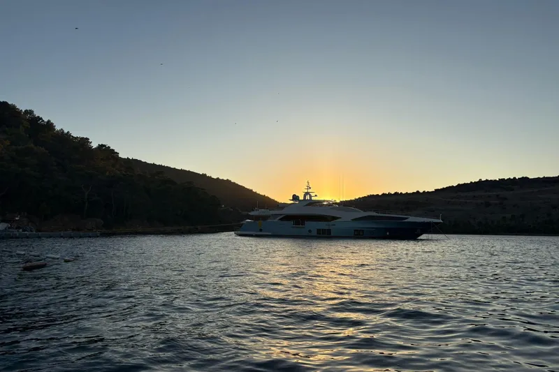 Elza Of London Yacht Photos Pics Luxurious 2015 Majesty 122 yacht at sunset on tranquil waters.