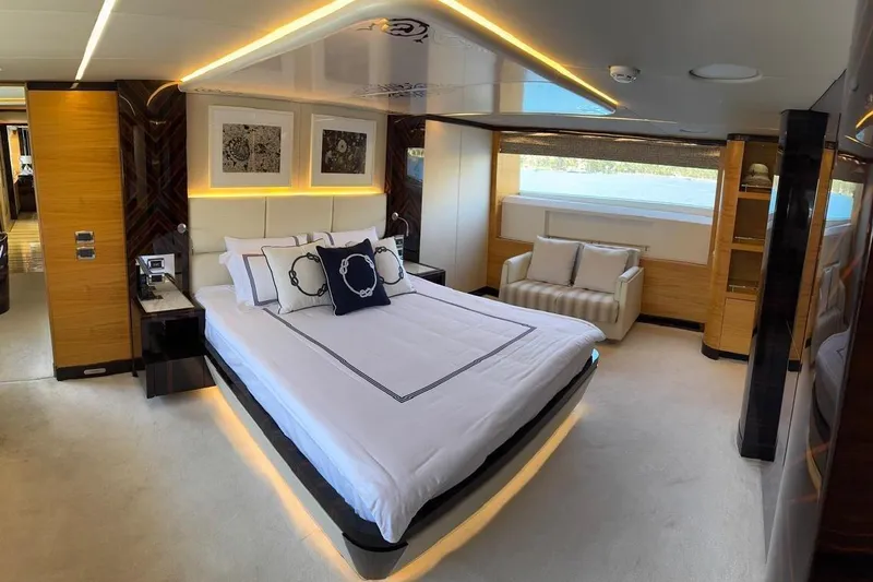 Elza Of London Yacht Photos Pics Luxurious bedroom interior on 2015 Majesty 122 yacht, featuring elegant decor and modern furnishings.
