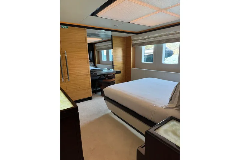 Elza Of London Yacht Photos Pics Luxurious bedroom interior on 2015 Majesty 122 yacht, featuring modern design and large windows.