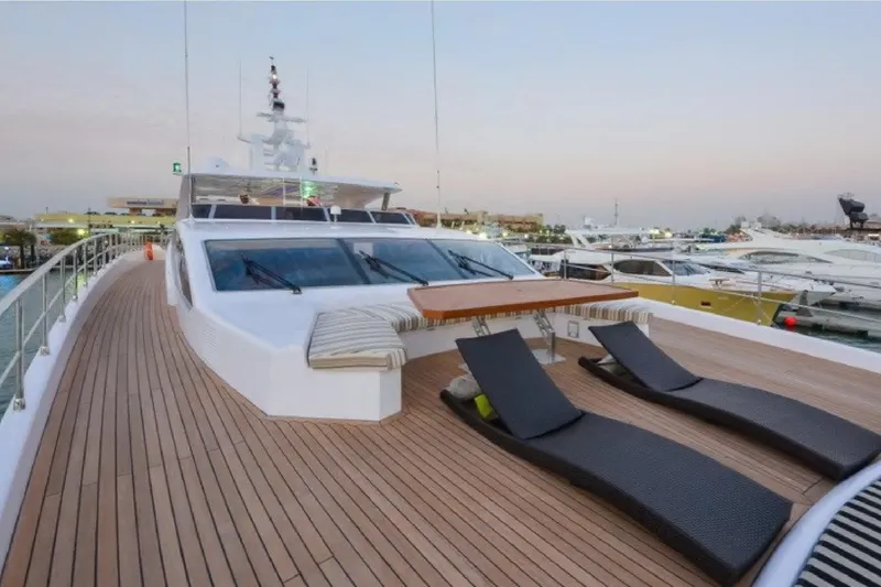 Elza Of London Yacht Photos Pics Luxurious 2015 Majesty 122 yacht deck with sun loungers at sunset in marina.