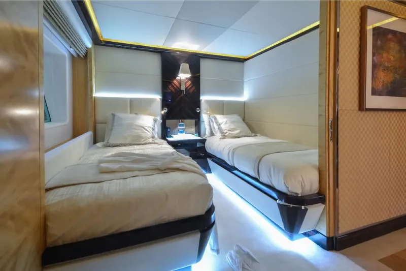 Elza Of London Yacht Photos Pics Luxurious twin bedroom on 2015 Majesty 122 yacht, featuring modern lighting and elegant decor.