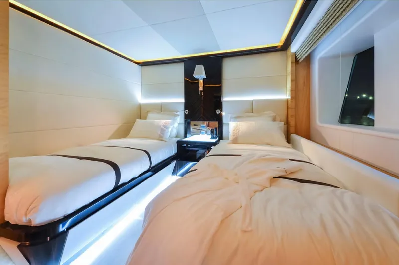 Elza Of London Yacht Photos Pics Luxurious twin bedroom on 2015 Majesty 122 yacht, featuring modern lighting and elegant decor.