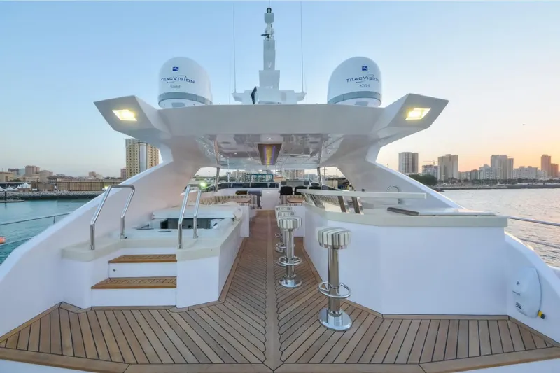 Elza Of London Yacht Photos Pics Luxurious 2015 Majesty 122 yacht deck with modern seating and city skyline backdrop.