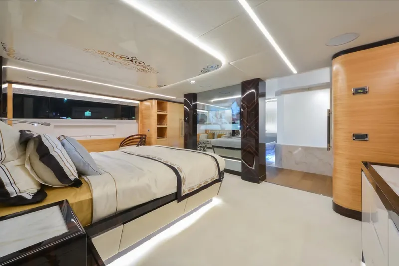 Elza Of London Yacht Photos Pics Luxurious bedroom interior on 2015 Majesty 122 yacht, featuring modern design and elegant furnishings.