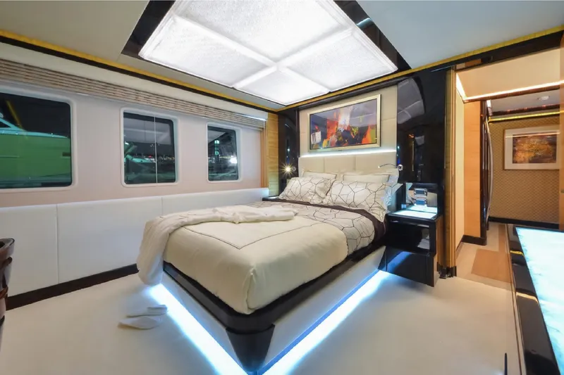 Elza Of London Yacht Photos Pics Luxurious bedroom interior on 2015 Majesty 122 yacht, featuring modern design and ambient lighting.