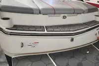 2019 MasterCraft NXT22 boat, rear view with gray seating and hexagonal flooring.