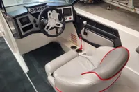 2019 MasterCraft NXT22 boat interior with steering wheel and captain's seat.