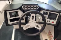 2019 MasterCraft NXT22 boat dashboard with steering wheel and control panels.