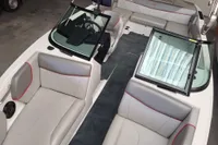 2019 MasterCraft NXT22 boat interior with gray seating and red accents.