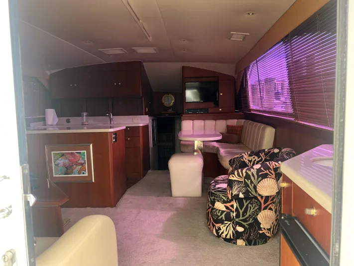 Fender Bender Yacht Photos Pics Interior of 1996 Ocean Yachts 48 Super Sport with cozy seating and modern amenities.