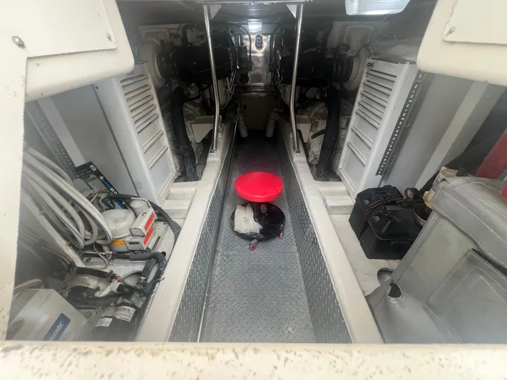 Fender Bender Yacht Photos Pics Engine room of 1996 Ocean Yachts 48 Super Sport, featuring dual engines and equipment.