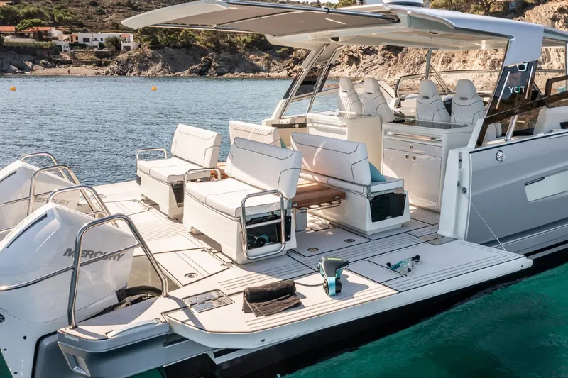 Yacht Photos Pics Luxury YOT 36 boat, 2025 model, with spacious seating and modern design on clear waters.