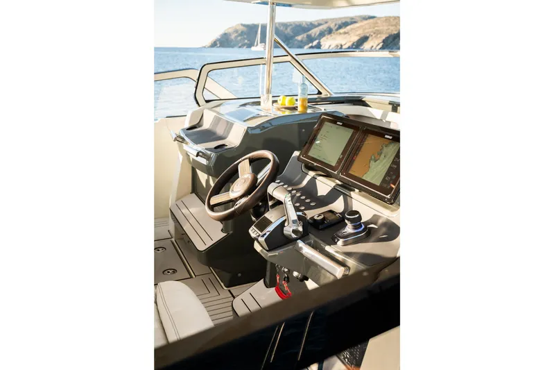  Yacht Photos Pics Helm of 2025 YOT 36 boat with dual navigation screens and steering wheel.