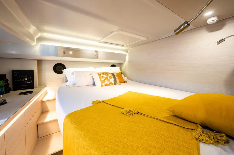  Yacht Photos Pics Luxurious YOT 36 yacht bedroom interior, 2025 model, with cozy bedding and modern lighting.