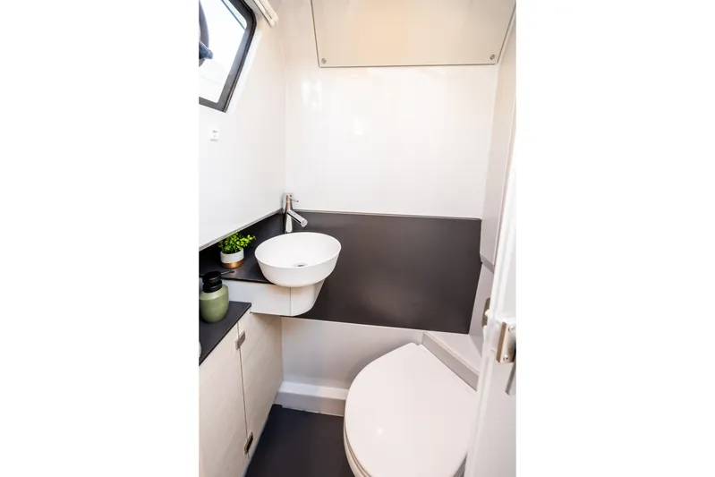  Yacht Photos Pics Modern bathroom in 2025 YOT 36 yacht with sleek fixtures and compact design.